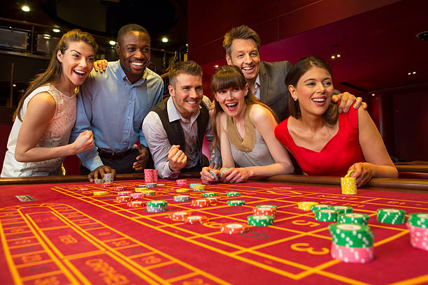Live-dealer studio with professional croupiers at blackjack table